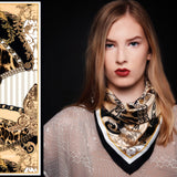 Female model wearing Baroque printed silk scarf, gold, black & white